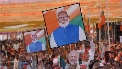 Supporters of Bharatiya Janata Party hold portraits of Prime Minister Narendra Modi during a public meeting ahead of the upcoming Gujarat state assembly elections in Mehsana. (AP) Supporters of Bharatiya Janata Party hold portraits of Prime Minister Narendra Modi during a public meeting ahead of the upcoming Gujarat state assembly elections in Mehsana. (AP)