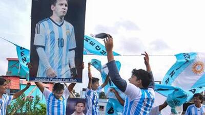 Fans dance as they celebrate after Argentina football teams victory over Mexico (PTI Photo) Fans dance as they celebrate after Argentina football teams victory over Mexico (PTI Photo)