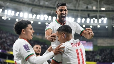 Morocco's Abdelhamid Sabiri (11) celebrates his goal with teammates Zakaria Aboukhlal, left, and Yahya Jabrane, top, after scoring during the FIFA World Cup group F match between Belgium and Morocco, at the Al Thumama Stadium in Doha. (AP) Morocco's Abdelhamid Sabiri (11) celebrates his goal with teammates Zakaria Aboukhlal, left, and Yahya Jabrane, top, after scoring during the FIFA World Cup group F match between Belgium and Morocco, at the Al Thumama Stadium in Doha. (AP)