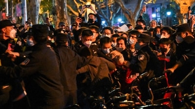 Police and people are pictured during some clashes in Shanghai. (AFP)
