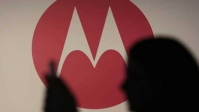 A woman takes a picture in front of a Motorola logo before the worldwide presentation of the Moto G mobile phone in Sao Paulo. (Photo:Reuters/Nacho Doce) A woman takes a picture in front of a Motorola logo before the worldwide presentation of the Moto G mobile phone in Sao Paulo. (Photo:Reuters/Nacho Doce)