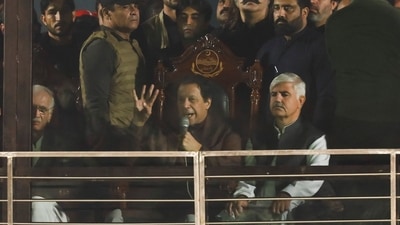 Pakistan's former Prime Minister, Imran Khan, addresses his supporters from behind a bullet-proof glass window, in his first public appearance since being wounded in a gun attack. (REUTERS)