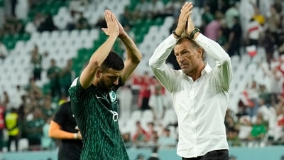 Saudi Arabia's Abdulelha Al-Malki, left, and Saudi Arabia's head coach Herve Renard applaud fans at the end of the World Cup group C soccer match between Poland and Saudi Arabia, at the Education City Stadium in Al Rayyan. (AP) Saudi Arabia's Abdulelha Al-Malki, left, and Saudi Arabia's head coach Herve Renard applaud fans at the end of the World Cup group C soccer match between Poland and Saudi Arabia, at the Education City Stadium in Al Rayyan. (AP)