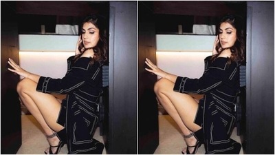 Rhea decked up in a black corset cropped top with white details, and teamed it with a black cropped jacket and folded sleeves. She layered her look with a black short skirt with white lines running at the borders. (Instagram/@rhea_chakraborty)