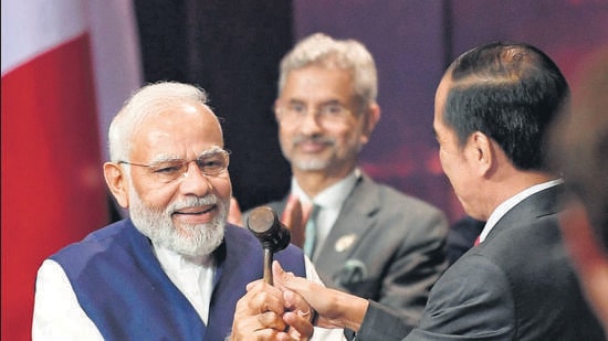 Bali, Nov 16 (ANI): President of Indonesia Joko Widodo symbolically handed over the G20 Presidency to Prime Minister Narendra Modi at the G20 summit, in Bali on Wednesday. (ANI Photo) (ANI/ PIB)