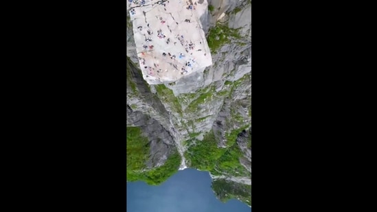 A screengrab from the viral video shows the aerial view of Norway's Pulpit Rock. It is the same location where the climactic fight in the sixth Mission Impossible film was shot. (Twitter/@gunsnrosesgirl3)