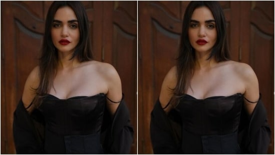 Gabriella decked up in a black off-shoulder corset top and teamed it with a pair of black corset trousers. She added more oomph to her look with a black long coat styled around her arms. In matching heels, she completed her look for the day.(Instagram/@gabriellademetriades)