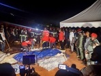 Rescuers prepare to carry a body after a landslide, which killed people who were attending a funeral, the governor of Cameroon's Centre Region said, in Yaounde, Cameroon November 27, 2022. 