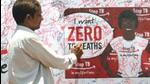 A volunteer signs a signature campaign poster during a TB awareness programme. (Getty Images) A volunteer signs a signature campaign poster during a TB awareness programme. (Getty Images)