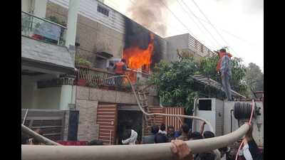 Firefighters trying to control a fire that broke out at a house of Vikas Nagar in Lucknow on Monday. (Deepak gupta/ht)