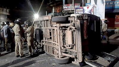 Police personnel gathered near an overturned police vehicle during an attack on Vizhinjam police station, in Thiruvananthapuram on Sunday. (ANI) Police personnel gathered near an overturned police vehicle during an attack on Vizhinjam police station, in Thiruvananthapuram on Sunday. (ANI)
