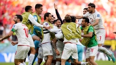 Iran's Rouzbeh Cheshmi, not seen, celebrates scoring the opening goal with teammates during the World Cup group B soccer match between Wales and Iran, at the Ahmad Bin Ali Stadium in Al Rayyan , Qatar. (AP) Iran's Rouzbeh Cheshmi, not seen, celebrates scoring the opening goal with teammates during the World Cup group B soccer match between Wales and Iran, at the Ahmad Bin Ali Stadium in Al Rayyan , Qatar. (AP)