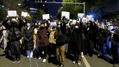 Videos and images circulating on social media show students holding up sheets of white paper and shouting "Democracy and rule of law! Freedom of expression!." (REUTERS)
