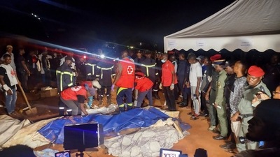 Rescuers prepare to carry a body after a landslide, which killed people who were attending a funeral, the governor of Cameroon's Centre Region said, in Yaounde, Cameroon November 27, 2022. (REUTERS)