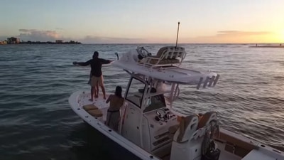 The image, taken from the Facebook video, shows the man and his finance on a boat. (Facebook/@Scott Clyne)