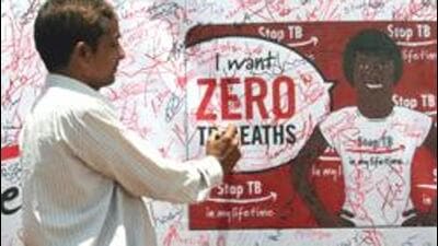 A volunteer signs a signature campaign poster during a TB awareness programme. (Getty Images) A volunteer signs a signature campaign poster during a TB awareness programme. (Getty Images)