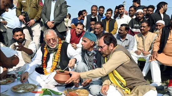 BJP leaders at a Khichdi Panchayat in Rampur. (ANI PHOTO) BJP leaders at a Khichdi Panchayat in Rampur. (ANI PHOTO)
