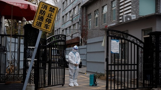An epidemic-prevention worker in a protective suit stands guard at the gate of a residential compound in Beijing, on November 28. “Zero COVID” was “supposed to demonstrate the superiority of the ‘Chinese model,' but ended up demonstrating the risk that when authoritarian regimes make mistakes, those mistakes can be colossal," Andrew Nathan, a Chinese politics specialist at Columbia University, told AP. He edited The Tiananmen Papers, an insider account of the government's response to the 1989 protests.(Thomas Peter / REUTERS)