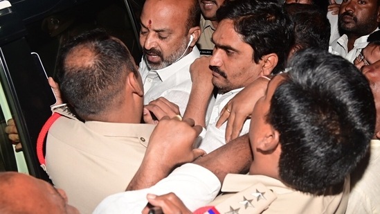Nirmal, Nov 27 (ANI): Telangana Bharatiya Janata Party (BJP) President Bandi Sanjay Kumar being taken into custody by the police ahead of the fifth leg of his "Praja Sangrama Yatra", in Nirmal on Sunday. (ANI Photo) (Mohammed Aleemuddin )