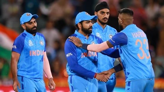 India's Rohit Sharma shakes hands with teammate India's Hardik Pandya, (AP)