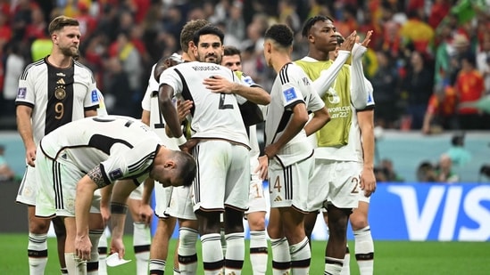 Germany's players react at the end of the Qatar 2022 World Cup Group E football match between Spain and Germany at the Al-Bayt Stadium in Al Khor