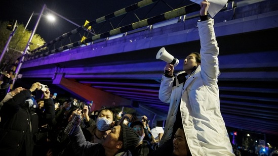 Covid protesters in China gathered on the weekend to mourn the death of victims who died during the deadly firing in Xinjiang, in which virus controls were blamed for hampering rescue efforts.(REUTERS)