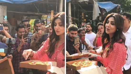 Shilpa Shetty distributes pizzas to people.