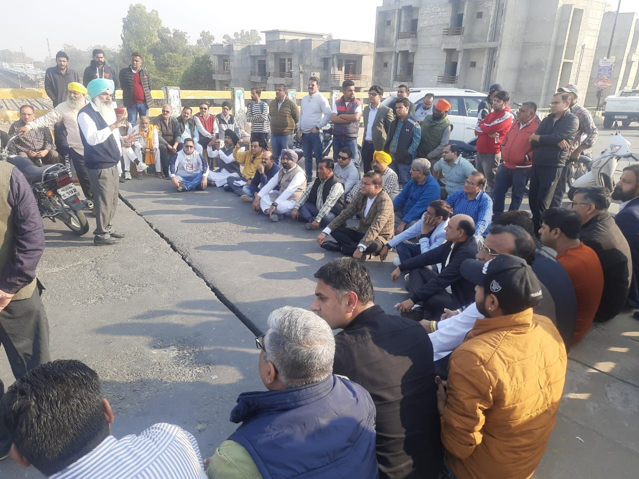 Residents protesting against the deteriorating law and order at the railway over bridge, connecting Ferozepur City and Cantonment, on Monday. (HT Photo)