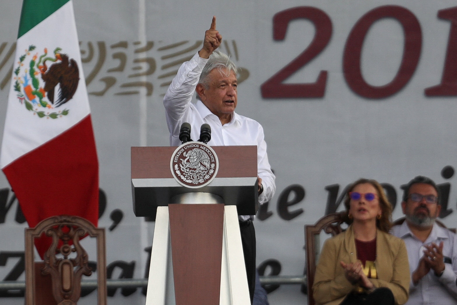 Mexican President Obrador gestures as he speaks after attending a march with supporters to mark his fourth year in office, in Mexico City. (REUTERS)