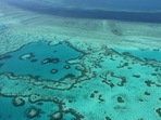 This file photo taken on November 20, 2014 shows an aerial view of the Great Barrier Reef off the coast of the Whitsunday Islands, along the central coast of Queensland.(AFP) This file photo taken on November 20, 2014 shows an aerial view of the Great Barrier Reef off the coast of the Whitsunday Islands, along the central coast of Queensland.(AFP)