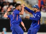 India's Umran Malik, left, celebrates with teammates after taking the wicket of New Zealand's Daryl Mitchell during their one day international cricket match in Auckland, New Zealand, Friday, Nov. 25, 2022. (Andrew Cornaga/Photosport via AP) India's Umran Malik, left, celebrates with teammates after taking the wicket of New Zealand's Daryl Mitchell during their one day international cricket match in Auckland, New Zealand, Friday, Nov. 25, 2022. (Andrew Cornaga/Photosport via AP)