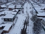 Siberia: A man shovels snow in the Siberian town of Tara in the Omsk region.