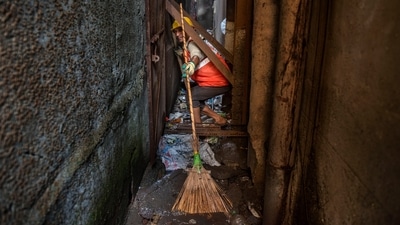 A Solid Waste Management (SWM) team worker of the D ward seen at work during the special cleanliness drive in Mumbai, on November 25. The drive is being conducted in lanes between cessed buildings. Cessed buildings are old or dilapidated mainly located in the city division of the BMC. (Satish Bate / HT Photo) A Solid Waste Management (SWM) team worker of the D ward seen at work during the special cleanliness drive in Mumbai, on November 25. The drive is being conducted in lanes between cessed buildings. Cessed buildings are old or dilapidated mainly located in the city division of the BMC. (Satish Bate / HT Photo)