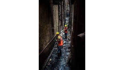 “As per the policy, BMC has to clean these lanes. We call them House Gullies and there are dedicated house gully cleaners in all parts of the ward. However, this time we have got all 146 house gully cleaners from the ward together to clean these lanes,” Shrikant Rathod, assistant engineer, SWM. D ward told HT. (Satish Bate / HT Photo) “As per the policy, BMC has to clean these lanes. We call them House Gullies and there are dedicated house gully cleaners in all parts of the ward. However, this time we have got all 146 house gully cleaners from the ward together to clean these lanes,” Shrikant Rathod, assistant engineer, SWM. D ward told HT. (Satish Bate / HT Photo)