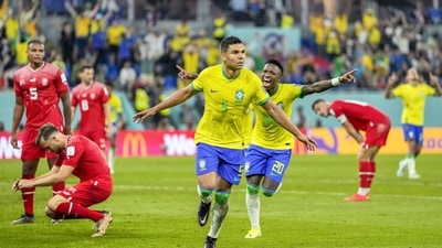 Brazil's Casemiro, center, celebrates after scoring his side's opening goal during the World Cup group G soccer match between Brazil and Switzerland (AP)