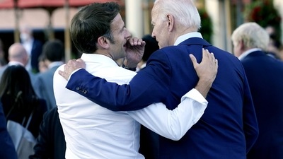 French President Emmanuel Macron whispers to US President Joe Biden. (AP File) French President Emmanuel Macron whispers to US President Joe Biden. (AP File)