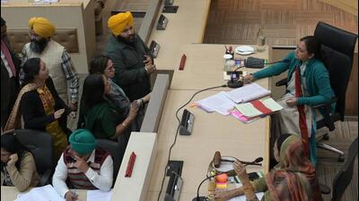 Chandigarh MC councillors gathered in the well of the House amid a showdown with MC chief Anindita Mitra in Chandigarh on Tuesday. (Ravi Kumar/HT) Chandigarh MC councillors gathered in the well of the House amid a showdown with MC chief Anindita Mitra in Chandigarh on Tuesday. (Ravi Kumar/HT)