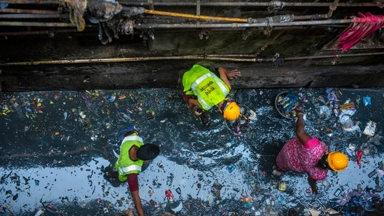 SWM employees clean a polluted lane&nbsp;during the special drive in Mumbai, on November 25.&nbsp;This special cleanliness drive will go on until the end of December.