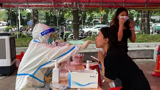 Covid In China: A resident gets swabbed for COVID test.(AP) Covid In China: A resident gets swabbed for COVID test.(AP)