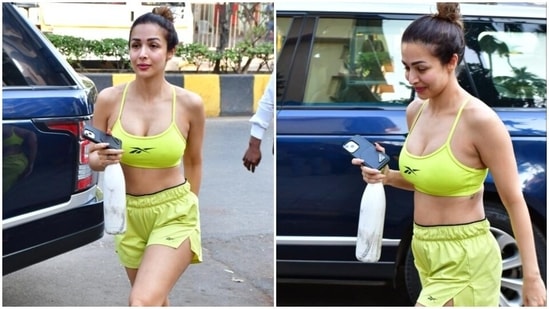 Malaika wore the sports bra with matching neon green shorts featuring a high-rise waist with an elastic band, side slits, and a baggy fitting. Keeping the vibe comfy and casual, she completed the outfit with pink flip-flops.(HT Photo/Varinder Chawla)