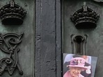 A photograph of late Queen Elizabeth II is pictured on the gate of Buckingham Palace in London.(AFP) A photograph of late Queen Elizabeth II is pictured on the gate of Buckingham Palace in London.(AFP)