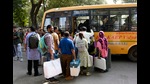 Polling officials carrying EVMs and other polling materials on the way to their respective polling stations on the eve of the first phase of Gujarat elections, in Surat on Wednesday. (ANI) Polling officials carrying EVMs and other polling materials on the way to their respective polling stations on the eve of the first phase of Gujarat elections, in Surat on Wednesday. (ANI)