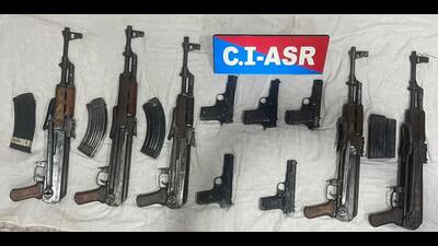 The five AK-47 assault rifles and five pistols besides magazines recovered by a joint team of Punjab Police and the Border Security Force from Wahka village in Ferozepur district around Tuesday midnight. (Twitter) The five AK-47 assault rifles and five pistols besides magazines recovered by a joint team of Punjab Police and the Border Security Force from Wahka village in Ferozepur district around Tuesday midnight. (Twitter)