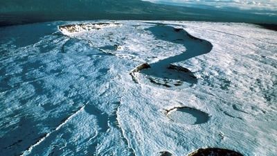 This file photo shows the Mauna Loa volcano in 1975, a few years before it erupted in 1984. “The flows are not threatening any downslope communities and all indications are that the eruption will remain in the Northeast Rift Zone. Volcanic gas and possibly fine ash and Pele's Hair may be carried downwind,” the USGS said. (USGS / REUTERS File) This file photo shows the Mauna Loa volcano in 1975, a few years before it erupted in 1984. “The flows are not threatening any downslope communities and all indications are that the eruption will remain in the Northeast Rift Zone. Volcanic gas and possibly fine ash and Pele's Hair may be carried downwind,” the USGS said. (USGS / REUTERS File)