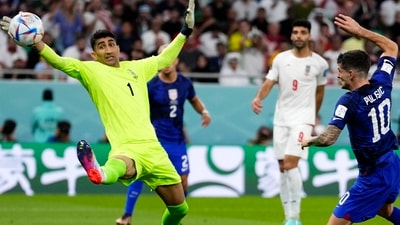 FIFA World Cup: Christian Pulisic of the United States, right, shoots to score his side's first goal past Iran's goalkeeper. (AP)