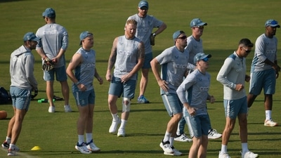 England's captain Ben Stokes (C) warms up along with teammates during a training session ahead of their first cricket Test match against Pakistan, at the Rawalpindi Cricket Stadium in Rawalpindi on November 28, 2022. (Photo by Aamir QURESHI / AFP) (AFP) England's captain Ben Stokes (C) warms up along with teammates during a training session ahead of their first cricket Test match against Pakistan, at the Rawalpindi Cricket Stadium in Rawalpindi on November 28, 2022. (Photo by Aamir QURESHI / AFP) (AFP)