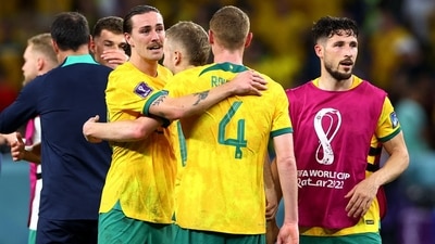 Australia's Jackson Irvine, Mathew Leckie and Kye Rowles celebrate after qualifying for the knockout stages (REUTERS)