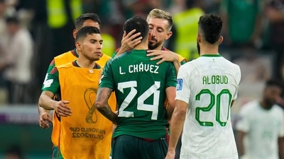 Mexico's Hector Herrera, center right, hugs Luis Chavez, center, after the FIFA World Cup group C soccer match between Saudi Arabia and Mexico, at the Lusail Stadium in Lusail. (AP) Mexico's Hector Herrera, center right, hugs Luis Chavez, center, after the FIFA World Cup group C soccer match between Saudi Arabia and Mexico, at the Lusail Stadium in Lusail. (AP)