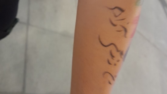 Premium Photo  Artist applying henna mehndi tattoo on female hand