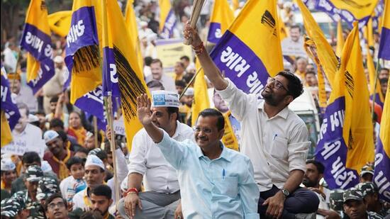 Arvind Kejriwal during a roadshow in Surat. (Twitter)